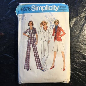 May include: Simplicity sewing pattern number 6876 for a jacket and pants. The pattern includes three different styles: a plaid jacket and pants, a white jacket and pants, and a red jacket with a white skirt. The pattern is for sizes 10 and 20, with a bust measurement of 40 to 42 inches.