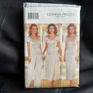 May include: A sewing pattern for a women's suit, featuring a double-breasted jacket and a skirt or pants. The pattern is by Donna Ricco, New York, and is size 12-14-16. The pattern is on a white background with a photo of a model wearing the suit.