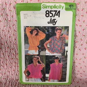 May include: Simplicity sewing pattern number 8574 for a Jiffy blouse. The pattern is for sizes 10-12 and includes instructions for making a blouse with a variety of sleeve options.