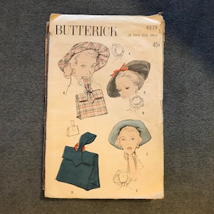 May include: Vintage sewing pattern for a hat, Butterick pattern number 4939, in size 45. The pattern shows three different styles of hats, all with a feminine and stylish design.