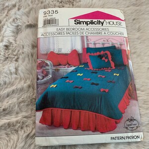 May include: A Simplicity House sewing pattern for easy bedroom accessories. The pattern shows a teal blue bed with a red ruffled bed skirt and a teal blue pillow with a red bow. The pattern number is 9335.