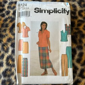May include: Simplicity sewing pattern number 8124 for sizes 14, 16, and 18. The pattern includes instructions for making a blouse and skirt with a plaid pattern, a sleeveless blouse, and a pair of pants.
