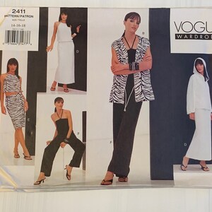 May include: Vogue Wardrobe sewing pattern featuring multiple women's outfits. The pattern includes a white hooded top and skirt, a black jumpsuit, and a zebra-print top and skirt. The pattern size is 14-16-18.