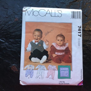 May include: A McCall's 7417 sewing pattern envelope for Little Me infant clothing. The front features two babies wearing outfits, with illustrations of three variations below. The text includes 'McCall's', '7417', and 'Little Me by/par Schwab'.