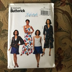 May include: A sewing pattern for four different outfits. The pattern is for sizes 14-16-18-20-22. The pattern is called "Lifestyle Wardrobe" and is from Butterick. The pattern includes a long floral dress, a short skirt with a top, a pair of pants with a top, and a jacket.