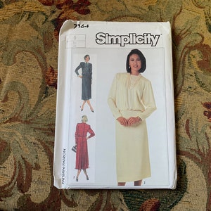 May include: Simplicity sewing pattern number 7164 for a dress with a skirt and a top. The pattern includes two different styles, one with a long sleeve and one with a short sleeve. The pattern is for sizes 6 to 24.