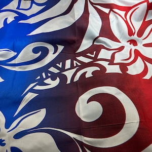 May include: A white fabric with a blue and red ombre design. The fabric has a floral pattern with white flowers on a blue background that fades to red.