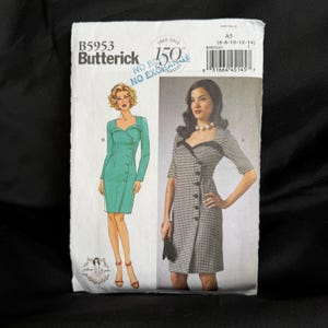May include: A Butterick sewing pattern, B5953, featuring illustrations of two different dresses. One dress is a solid teal color with long sleeves and a button closure. The other dress is a black and white checkered pattern with short sleeves and a button closure.
