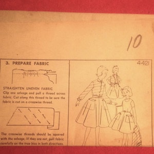May include: Vintage sewing pattern with illustrations and instructions for preparing fabric. The pattern includes diagrams and text, with the number "10" and the code "4421" visible. The paper has a worn, aged appearance.
