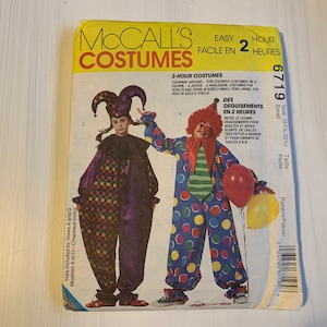 May include: McCall's Costumes sewing pattern 6719 for a clown costume. The pattern includes instructions for making a clown costume in two hours. The pattern is for sizes 31 1/2 to 32 1/2, petite. The pattern includes hats for views A and D.