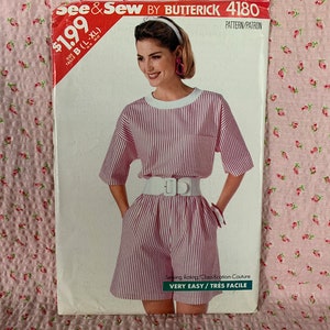 May include: A vintage sewing pattern for a striped shirt and shorts outfit. The pattern is from Butterick and is number 4180. The price is £1.99.