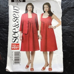 May include: A sewing pattern for a red dress with a tie at the waist. The pattern is from the brand "see & sew" and is labeled "B5479".