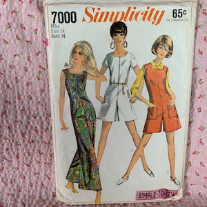 May include: Vintage Simplicity sewing pattern number 7000 for a dress with a bust size of 34 inches. The pattern features three different styles of dresses, including a long, flowing dress with a floral print, a short, white dress with a collar, and a short, orange dress with pockets.