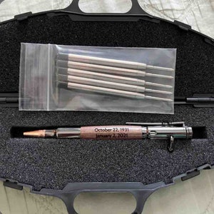 Customer submitted photo of a Walnut Bolt Action Pen resting inside of a Hard Black Pen Case.