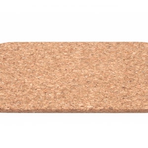 May include: A rectangular cork trivet with a light brown color and a slightly rounded edge.