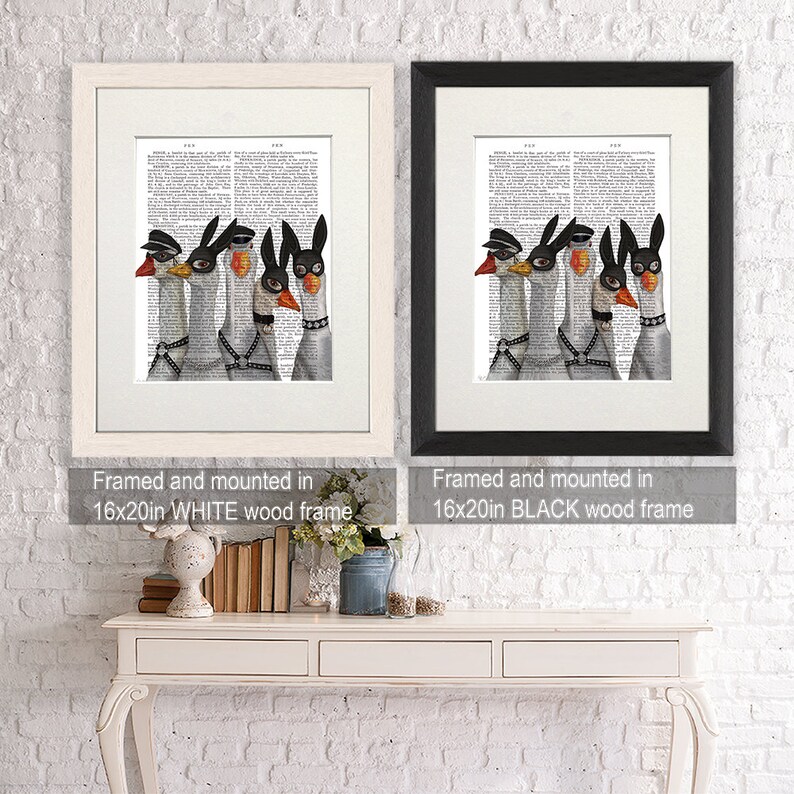 May include: Two framed prints of a group of four geese wearing black leather masks and collars. The prints are framed in white and black wood frames. The text "Framed and mounted in 16x20in WHITE wood frame" and "Framed and mounted in 16x20in BLACK wood frame" is below each print.