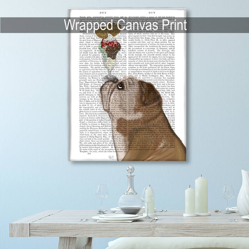 May include: Wrapped canvas print featuring a brown bulldog with a dessert on its head, set against a backdrop of vintage book pages. The text "Wrapped Canvas Print" is at the top.