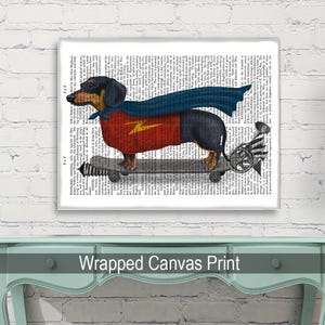 May include: A black and tan dachshund wearing a red and blue superhero cape and holding a lightning bolt, is skateboarding on a book page background.