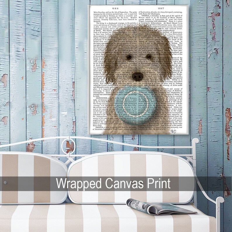 May include: Wrapped canvas print featuring a brown and white dog holding a blue and white frisbee. The background is a vintage book page with text.