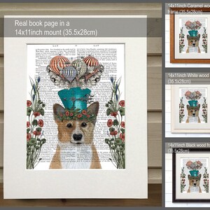 May include: A whimsical illustration of a corgi wearing a blue top hat with hot air balloons and flowers. The image is printed on a book page with text and framed in a variety of wood frames. The frames are 14x11 inches (35.5x28 cm).