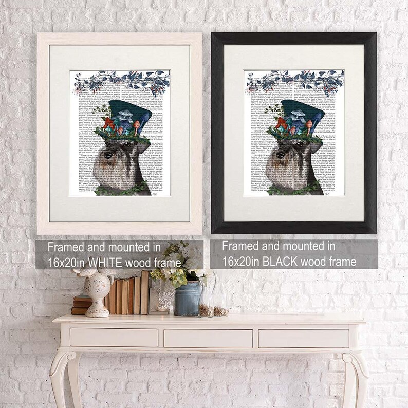 May include: Two framed prints of a dog wearing a hat with mushrooms on top. The print on the left is framed in white and the print on the right is framed in black. Both prints are 16x20 inches.
