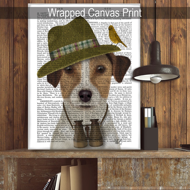 May include: A brown and white dog wearing a green and brown hat and a pair of binoculars. The dog is looking at the camera. The background is a page of text from an old book.