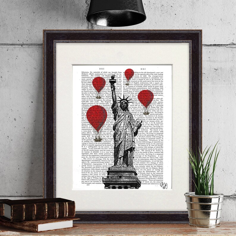 May include: A black and white illustration of the Statue of Liberty with red hot air balloons floating above her. The image is printed on a white background with black text.