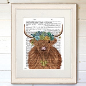 May include: A Highland cow with a floral crown made of succulents and flowers. The cow is brown and has a white face. The background is a vintage book page with text.
