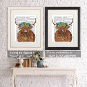 May include: A framed print of a Highland cow with a floral crown, available in a white or black wood frame. The print is 16 inches by 20 inches.