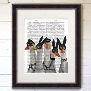 May include: Five geese wearing black and white masks and leather harnesses. The geese are standing in a row on a page of text from an old book. The text is about the history of the town of Penge, England.