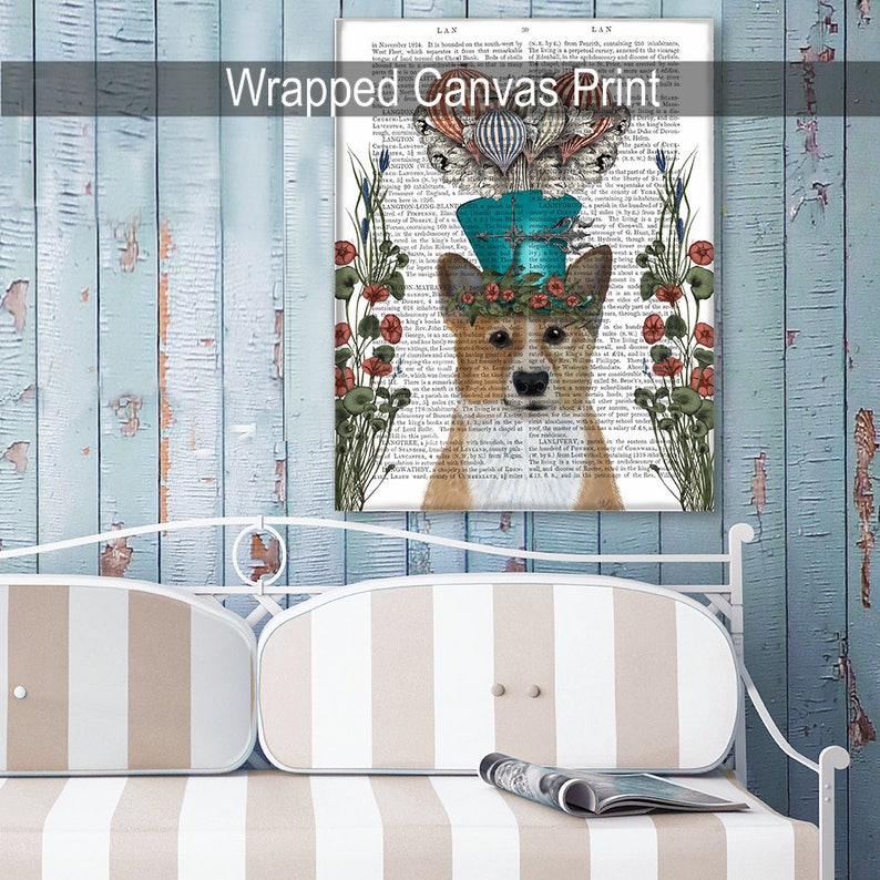 May include: A whimsical illustration of a corgi wearing a blue top hat with a feather and a floral crown. The background is a vintage book page with text and illustrations of flowers and hot air balloons.