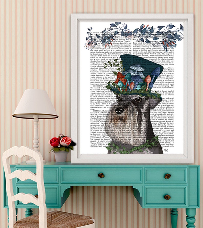 May include: A black and white Schnauzer dog wearing a blue top hat with a floral design and mushrooms. The dog is looking to the right. The background is a vintage book page.