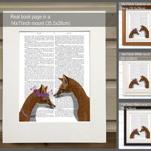 May include: A digital illustration of two foxes wearing flower crowns, printed on a book page with text. The image is framed in three different colors: caramel, white, and black. Each frame is 14 inches by 11 inches (35.5 cm by 28 cm).