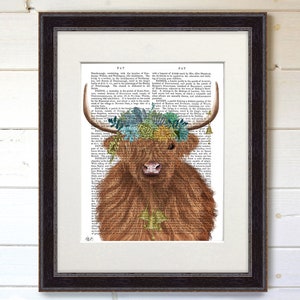 May include: A Highland cow with a floral crown made of succulents and flowers on a vintage book page background. The cow is brown and white with a fluffy coat. The text on the page is in black and white.