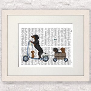 May include: A black and brown dachshund dog riding a blue scooter with two other dachshund dogs in a wooden wagon behind it. The dogs are on a printed page background.
