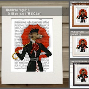 May include: A whimsical illustration of a dog wearing a black dress and a red hat, holding a red umbrella. The illustration is printed on a book page and framed in a black wood frame. The frame is 14 inches by 11 inches (35.5 cm by 28 cm).