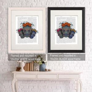 May include: Three sugar skulls with floral accents, framed in a white or black frame. The skulls are blue, orange, and pink with intricate designs. The frames are 16x20 inches.