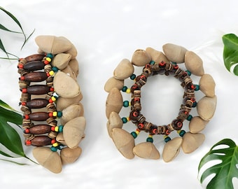 Pulsera Kenari, percusión musical portátil, PAR - Cáscara de nuez de Dora natural/cacha / Regalo para bailarines y músicos, para usar en tobillos y muñecas