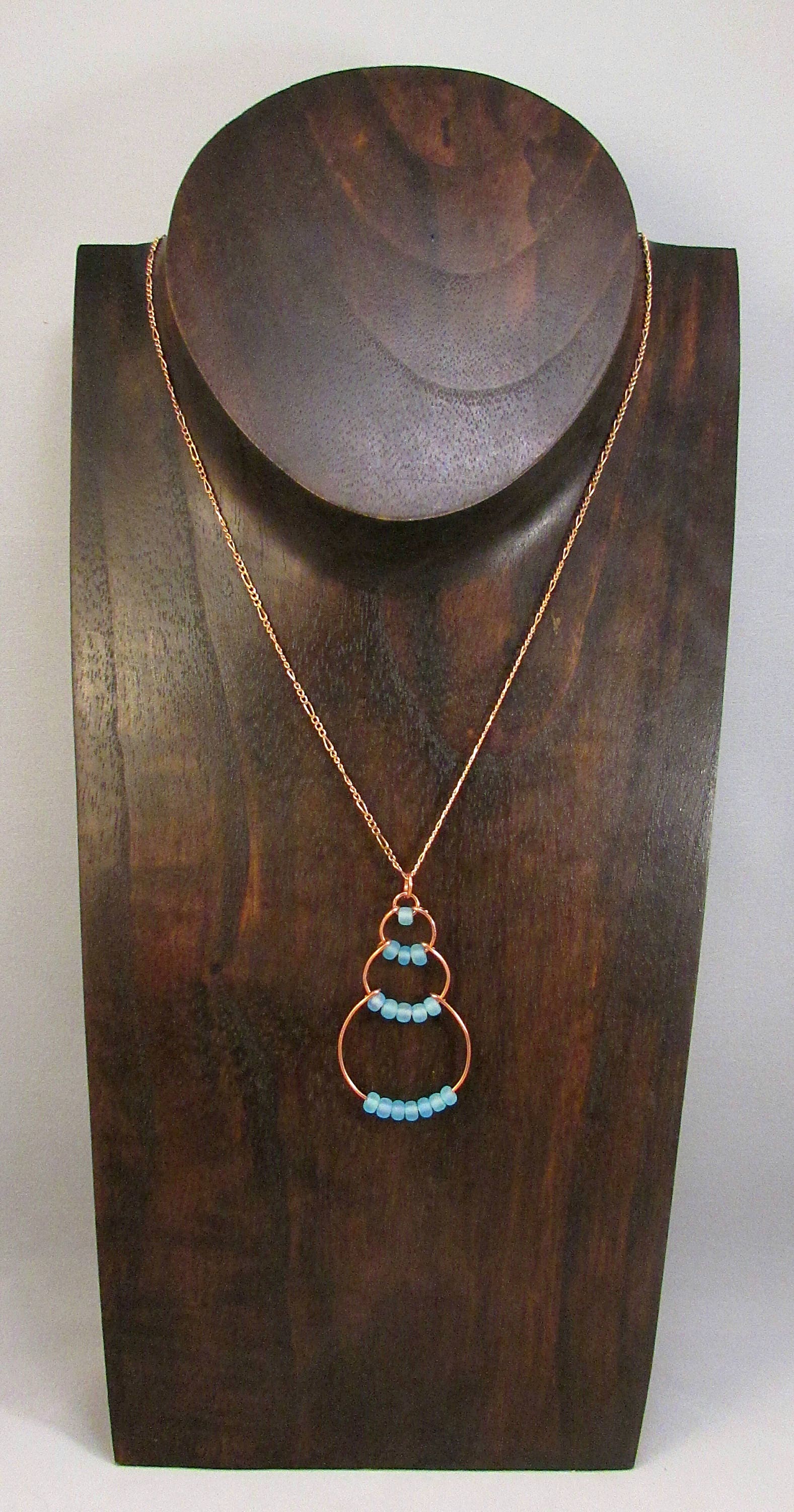 Copper wire bubble necklace with light blue beads