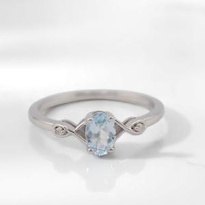 Sterling Silver Aquamarine Oval and Diamond Accented Genuine March Birthstone Infinity Style Ring