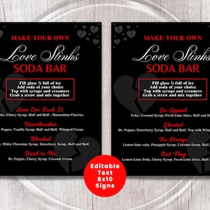 May include: Two black 8x10 signs with red and white text for a "Love Stinks Soda Bar." Each sign features a broken heart graphic and soda recipe ideas like "Love Can Suck It" and "Ex-Appeal."