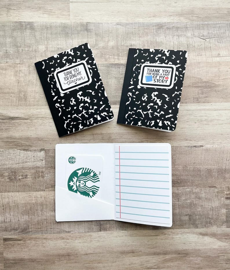 May include: Notebook-style gift card holders with black and white covers. The holders have the text "THANK YOU FOR BEING MY TEACHER" and "THANK YOU FOR BEING A PART OF MY STORY". One holder is open, revealing a Starbucks gift card.