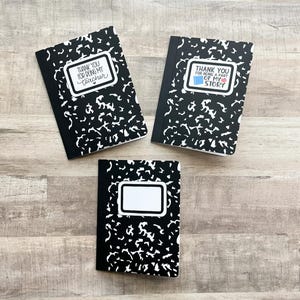 May include: Three composition notebooks with black and white speckled covers. Two notebooks have the text "THANK YOU FOR BEING MY TEACHER" and "THANK YOU FOR BEING A PART OF MY STORY" in white on a white label. The third notebook has a blank white label.