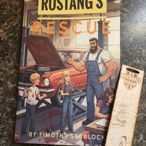 May include: A children's book titled "Rustang's Rescue" with a red classic car on the cover. The illustration shows a mechanic and children in a garage. A wooden bookmark with the book's title and a car image is also present.