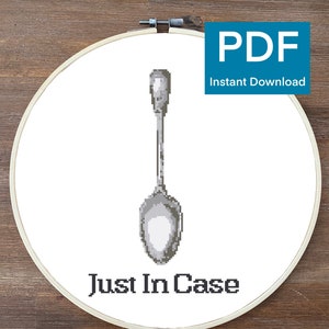 May include: A white embroidery hoop with a silver spoon and the text "Just In Case".