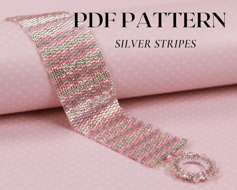 May include: A pink and silver beaded bracelet with a silver stripe pattern. The bracelet has a silver bead clasp. The bracelet is on a pink background with a white polka dot pattern. PDF PATTERN SILVER STRIPES is written in black text at the top of the image.