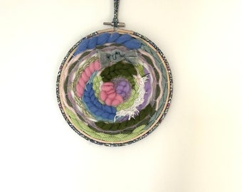 Circular wall weaving for children's room, mounted on wooden embroidery hoop