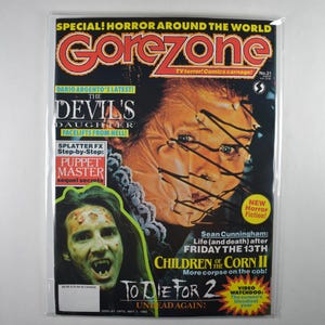 May include: Gorezone magazine cover featuring a collage of horror imagery. The cover includes the text "SPECIAL! HORROR AROUND THE WORLD" and "TV terror! Comics carnage!" along with images of monsters and the text "THE DEVIL'S DAUGHTER FACELIFTS FROM HELL!"