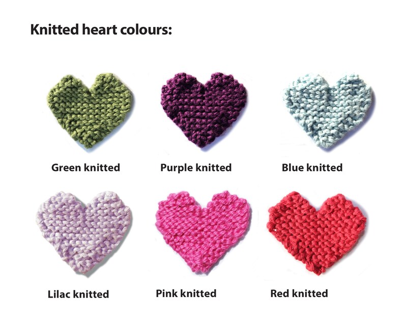May include: Six knitted hearts in different colors: green, purple, blue, lilac, pink, and red. The hearts are arranged in two rows of three.