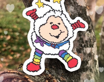 Pegatina de Sprite Twink: vinilo de dibujos animados vintage de los 80 con arcoíris brillante